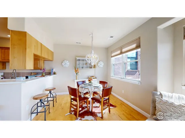 a kitchen with stainless steel appliances granite countertop a sink refrigerator and cabinets
