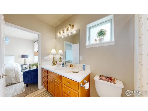 a bathroom with a sink a mirror and a toilet