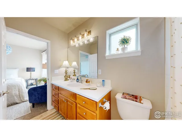 a bathroom with a sink a mirror and a toilet