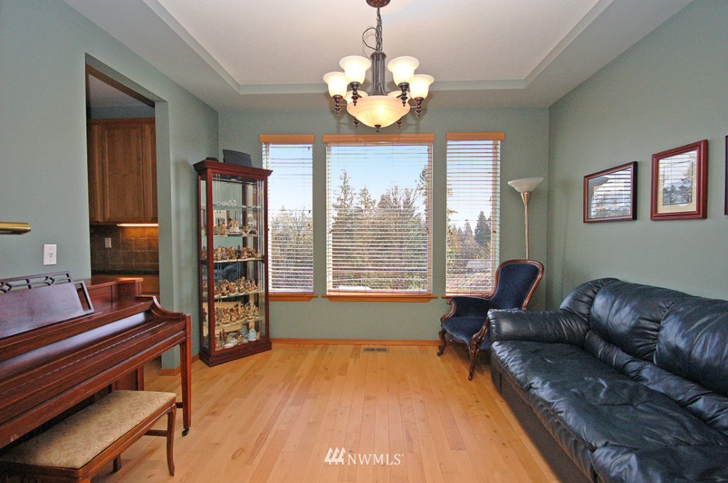 21107 1st Avenue West Bothell, WA 98021 - Photo 2 of 20 a living room with furniture and a chandelier