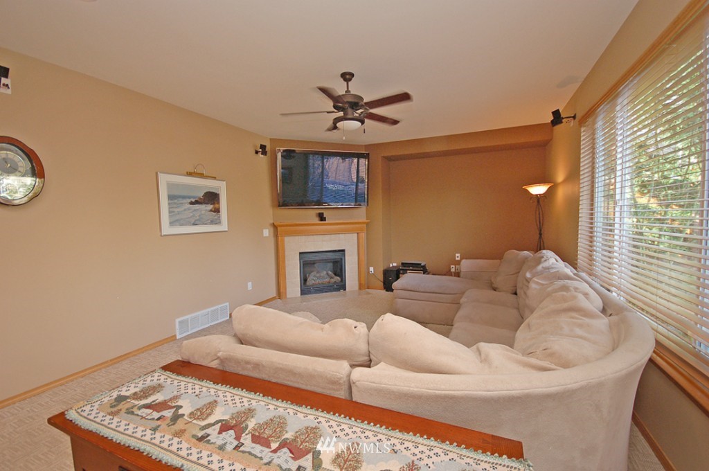 21107 1st Avenue West Bothell, WA 98021 - Photo 11 of 20 a living room with furniture and a fireplace