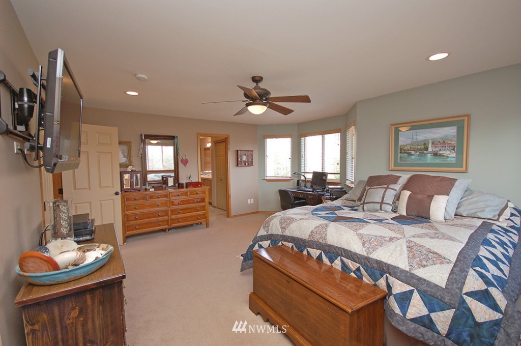 21107 1st Avenue West Bothell, WA 98021 - Photo 14 of 20 a bed room with bed and a chair