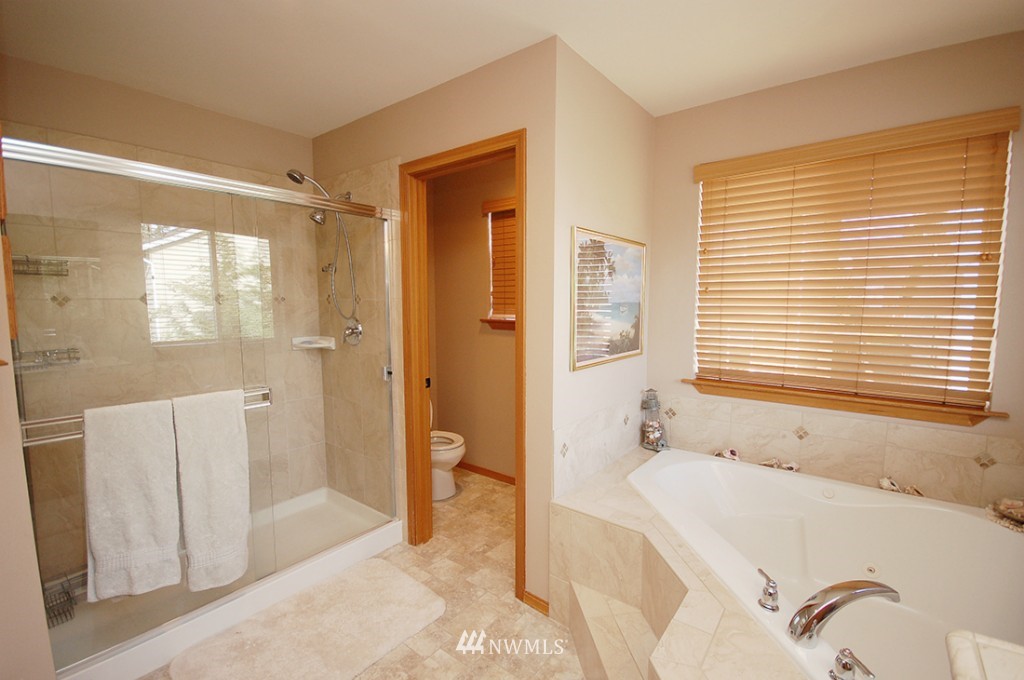 21107 1st Avenue West Bothell, WA 98021 - Photo 16 of 20 a bathroom with a tub shower and sink