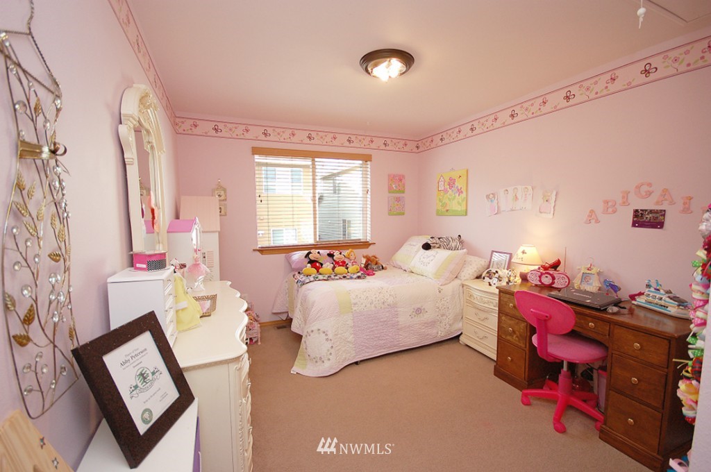 21107 1st Avenue West Bothell, WA 98021 - Photo 17 of 20 a bed room with bed and a window
