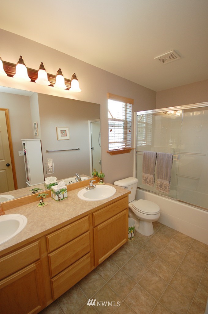 21107 1st Avenue West Bothell, WA 98021 - Photo 19 of 20 a bathroom with a sink a toilet and bathtub