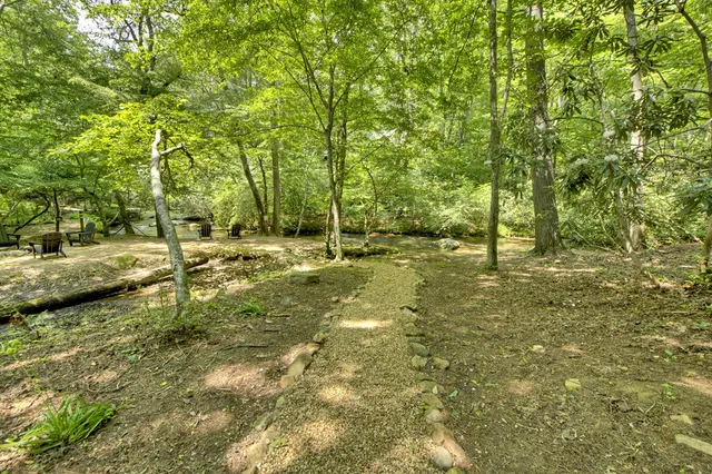 a park bench sitting in the middle of a lake