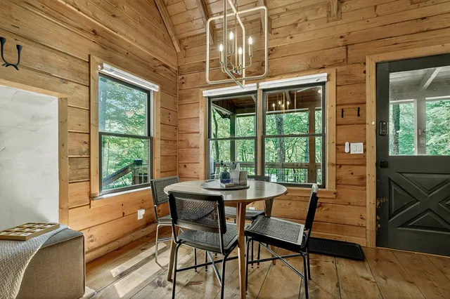 a dining room with furniture and windows
