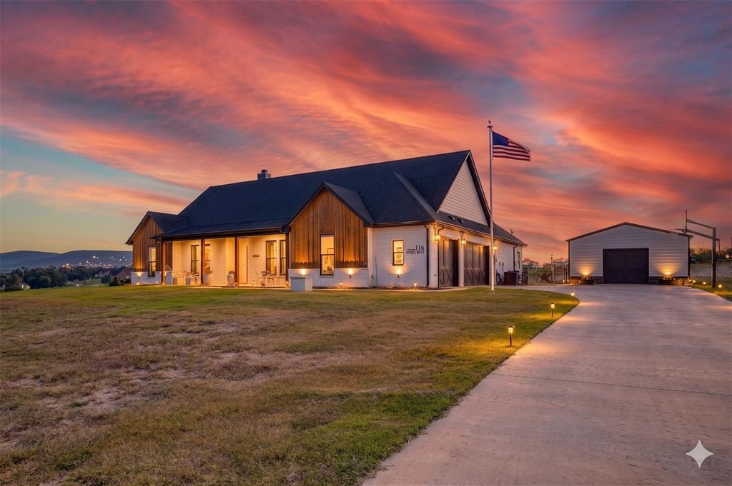 116 Aviara Ridge Road Poolville, TX 76487 - Photo 2 of 38 a front view of a house with a yard