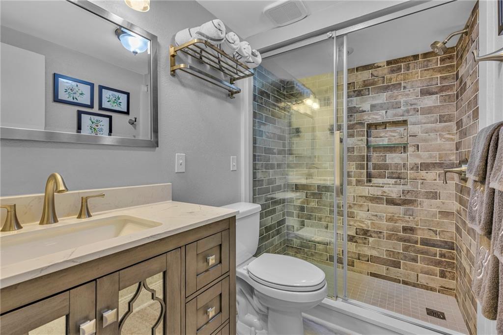610 Maple Lane, Unit 1 Sewickley, PA 15143 - Photo 12 of 31 a bathroom with a sink a toilet and shower