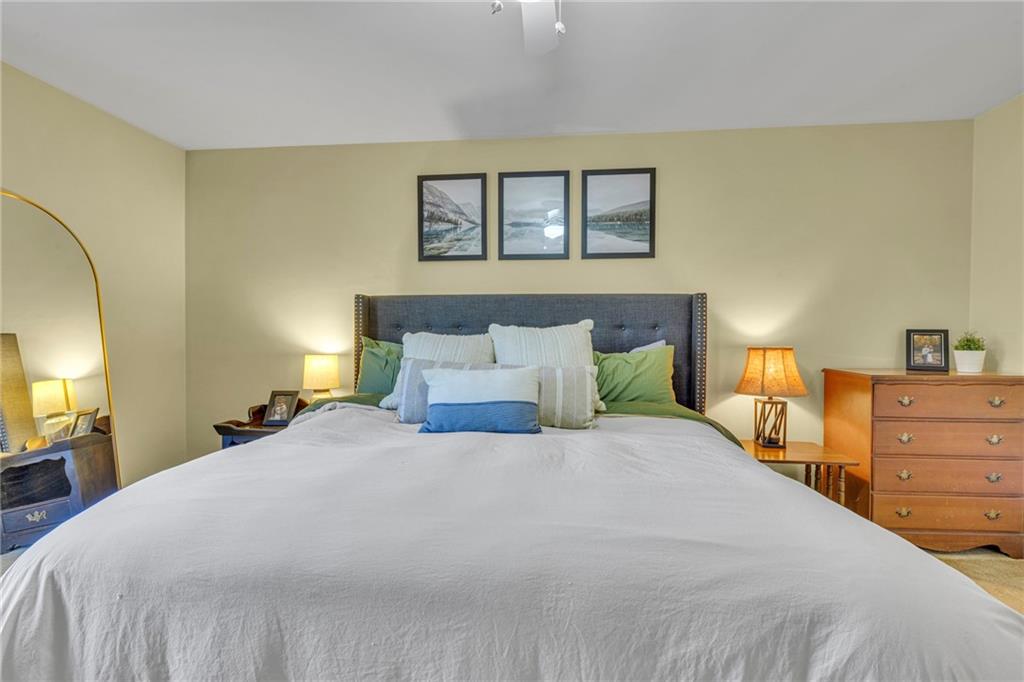 610 Maple Lane, Unit 1 Sewickley, PA 15143 - Photo 15 of 31 a bedroom with a bed and a painting on the wall