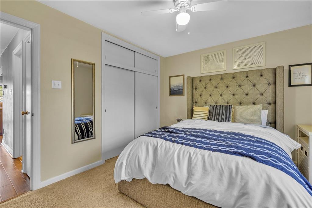 610 Maple Lane, Unit 1 Sewickley, PA 15143 - Photo 17 of 31 a bedroom with a bed and lamp