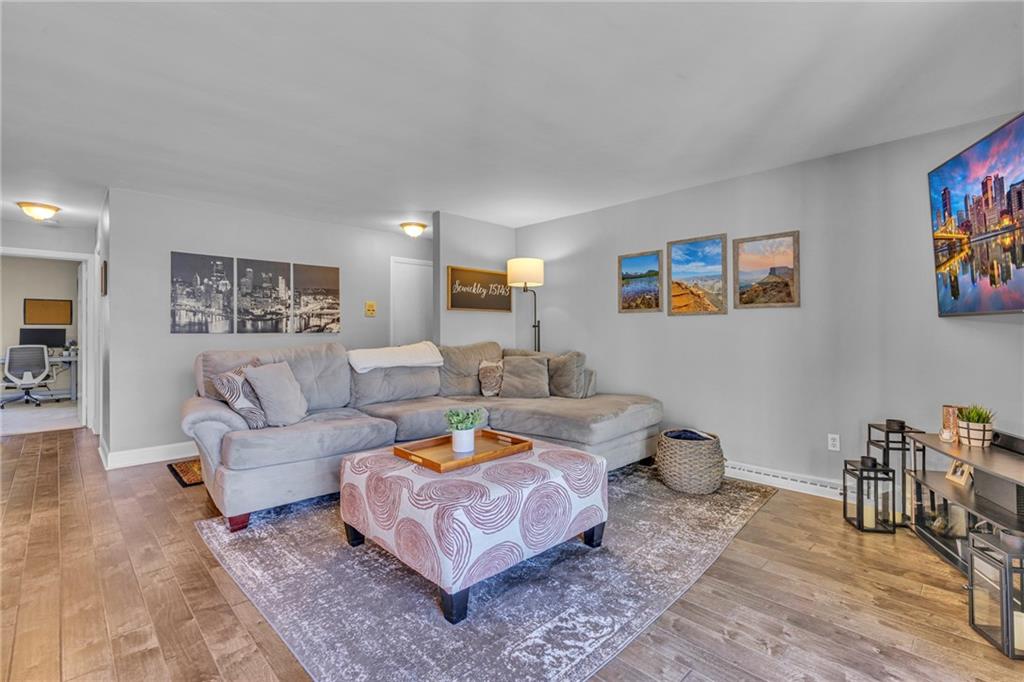 610 Maple Lane, Unit 1 Sewickley, PA 15143 - Photo 7 of 31 a living room with furniture and painting on the wall