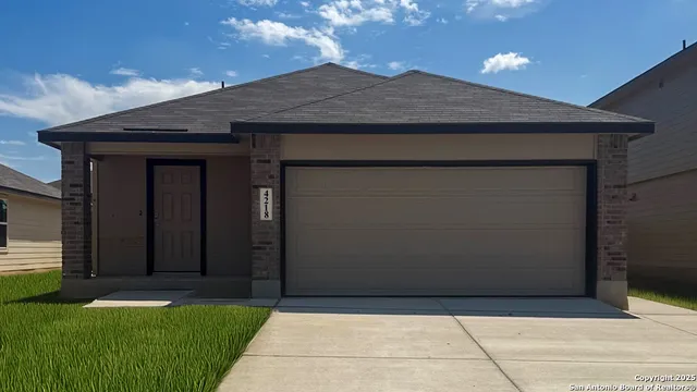 a backyard of a house with potted plants