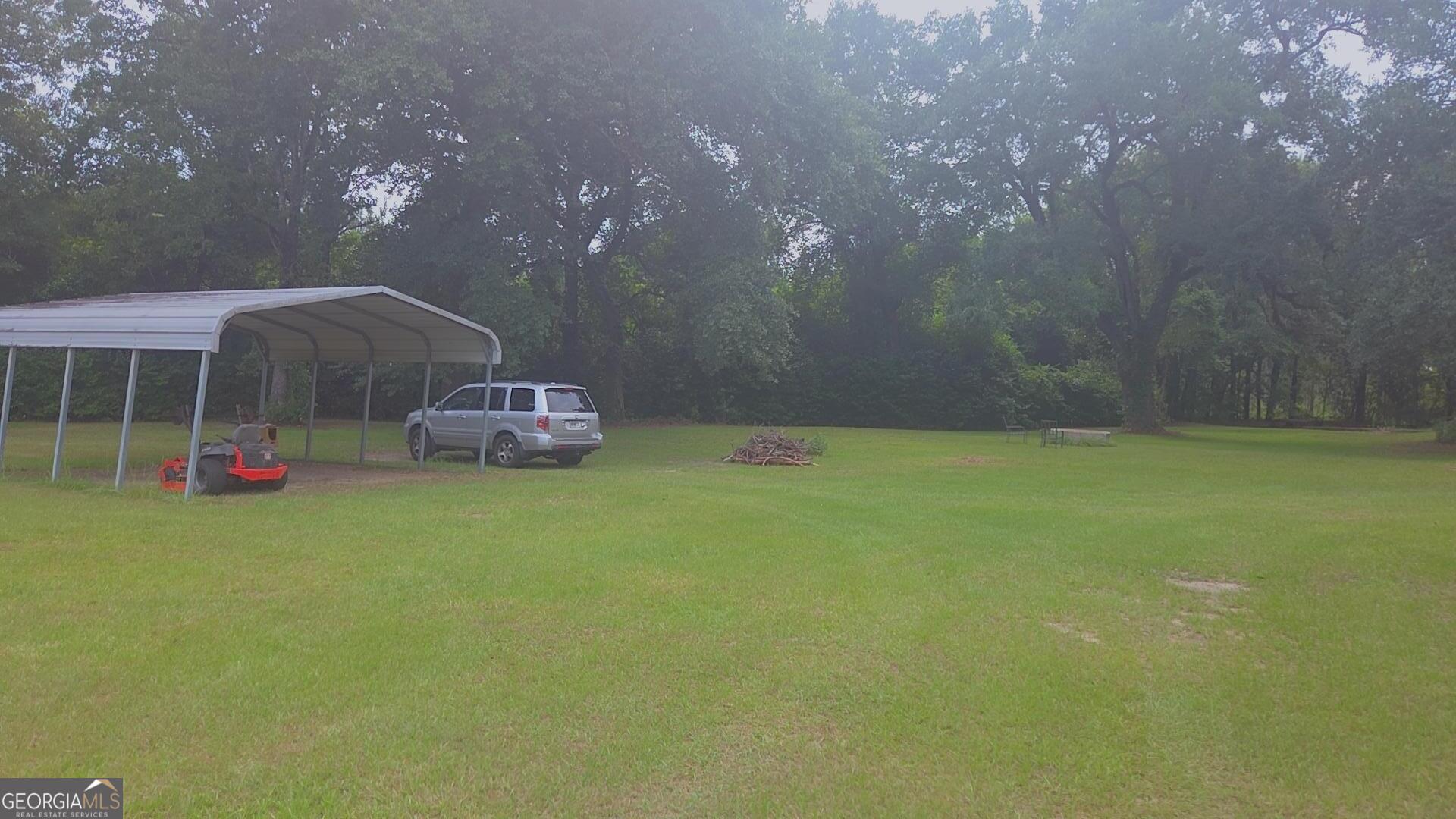 8468 Branchville Road Camilla, GA 31730 - Photo 17 of 22 a bath room with a yard