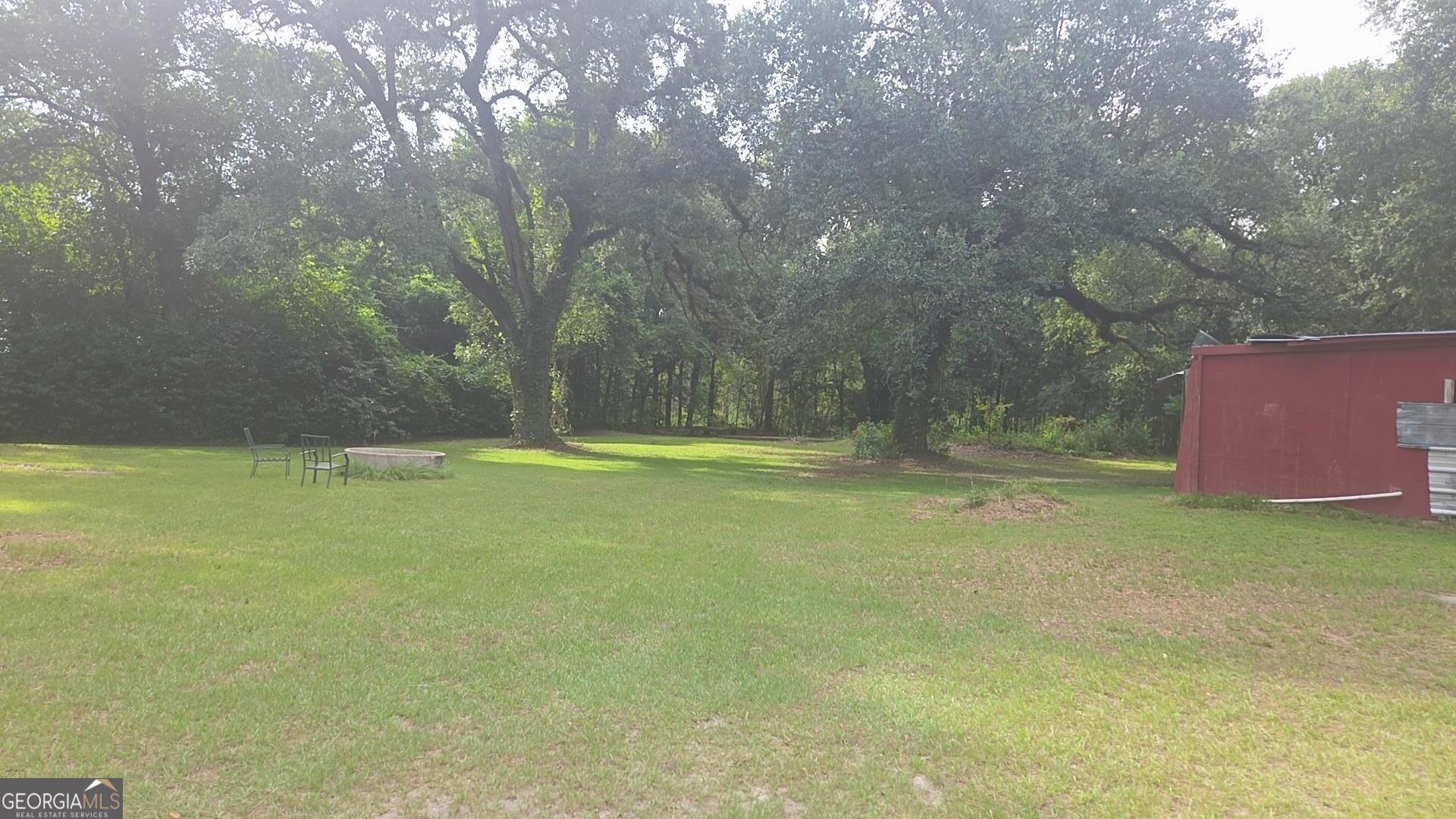 8468 Branchville Road Camilla, GA 31730 - Photo 18 of 22 a view of outdoor space with deck and yard