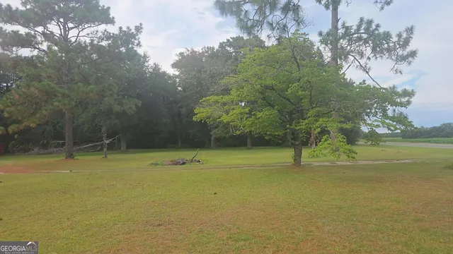 a view of a swimming pool with an outdoor space and seating area