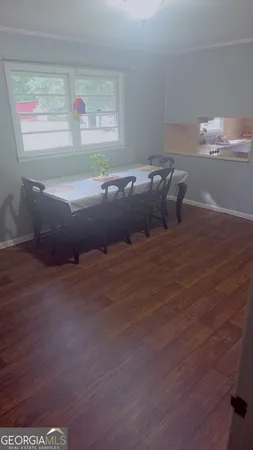 a view of bed and wooden floor