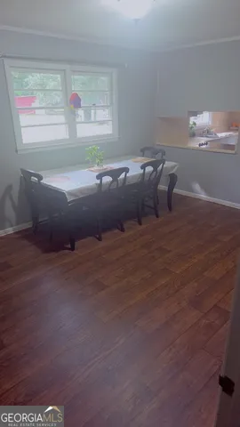 a view of bed and wooden floor