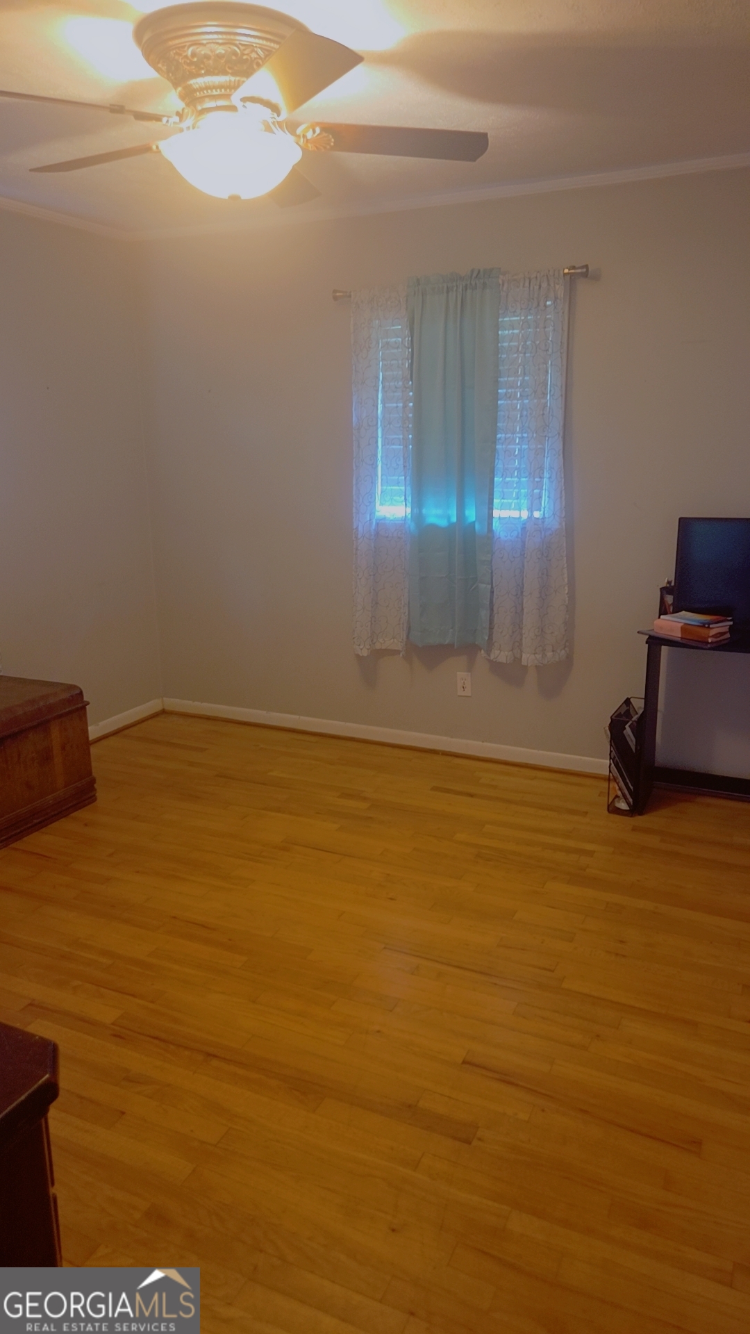 8468 Branchville Road Camilla, GA 31730 - Photo 10 of 22 a view of empty room with wooden floor