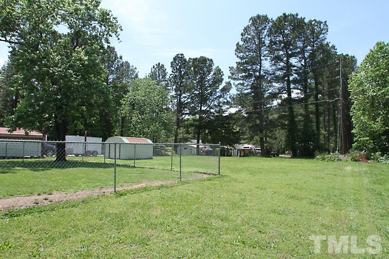 4706 Revere Road Durham, NC 27713 - Photo 11 of 13 a backyard of a house with lots of green space