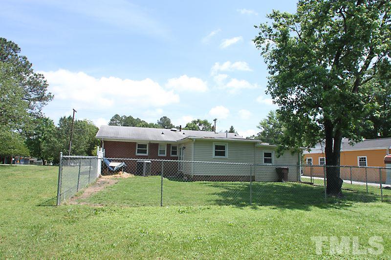4706 Revere Road Durham, NC 27713 - Photo 13 of 13 a view of a house with a back yard