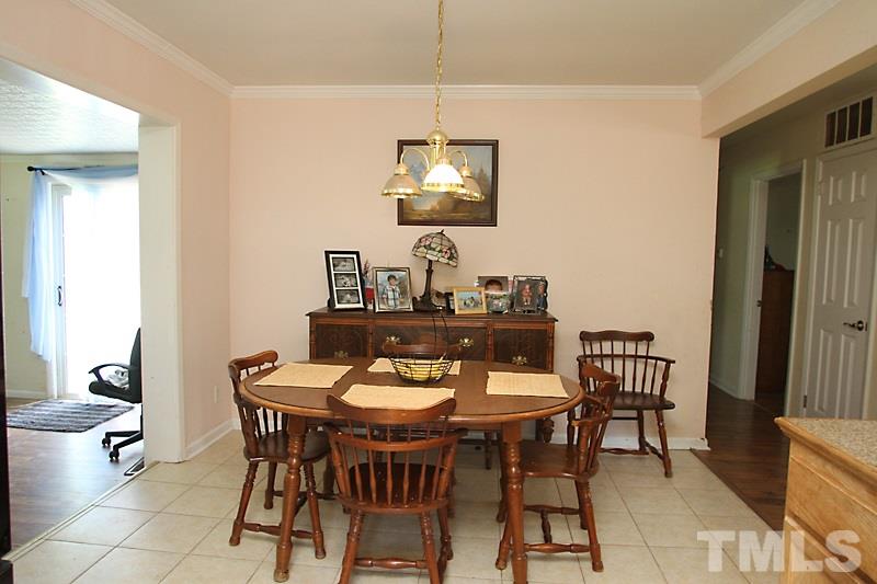 4706 Revere Road Durham, NC 27713 - Photo 4 of 13 a dining room with furniture and window