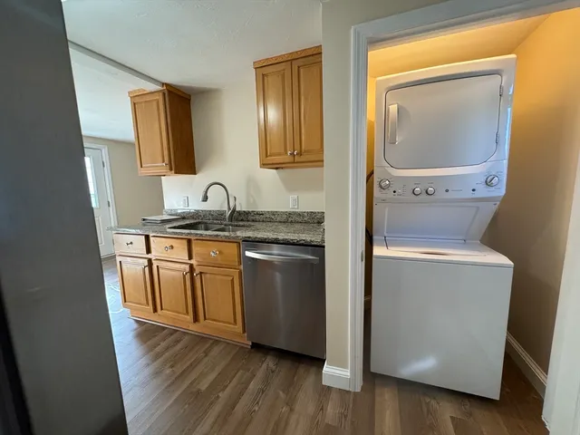 a kitchen with a refrigerator and a sink