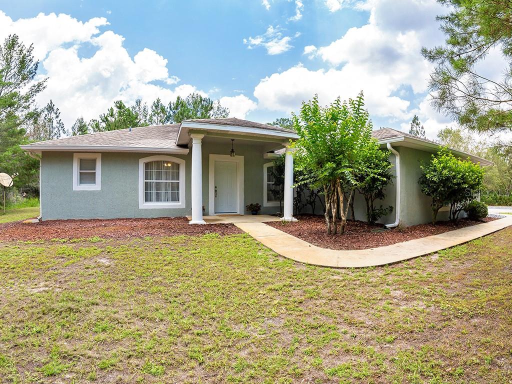 41514 Apple Street Eustis, FL 32736 - Photo 1 of 1 a view of a house with backyard and garden