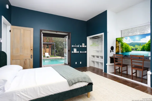 a living room with furniture and a floor to ceiling window