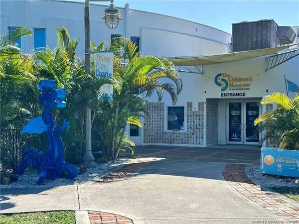 a view of a swimming pool with a yard