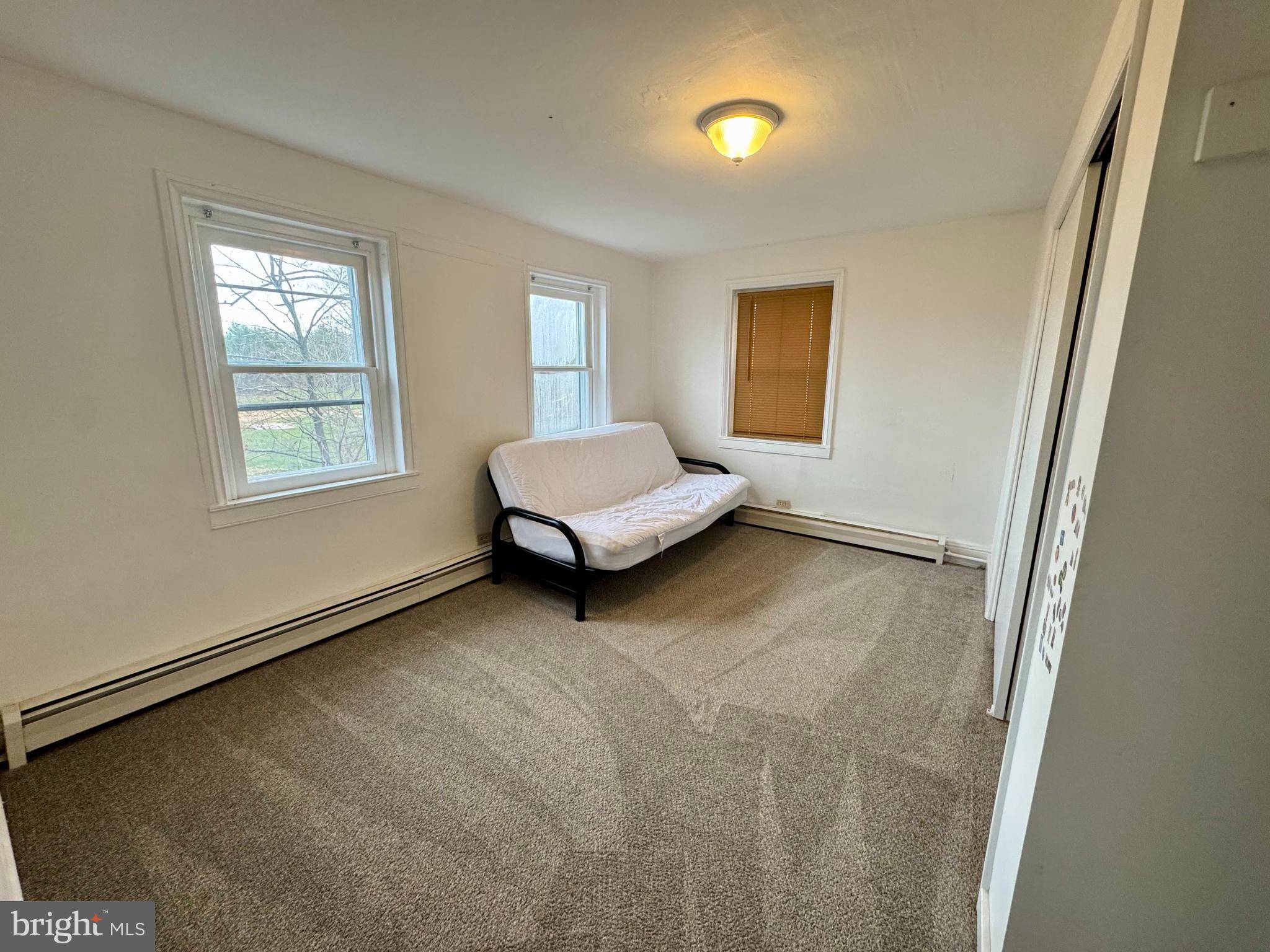180 Sassamansville Road Gilbertsville, PA 19525 - Photo 11 of 20 a living room with furniture and a window