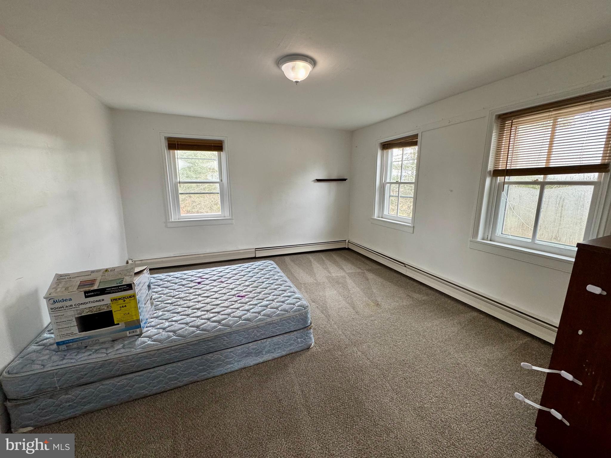 180 Sassamansville Road Gilbertsville, PA 19525 - Photo 12 of 20 a bedroom with a bed and a window