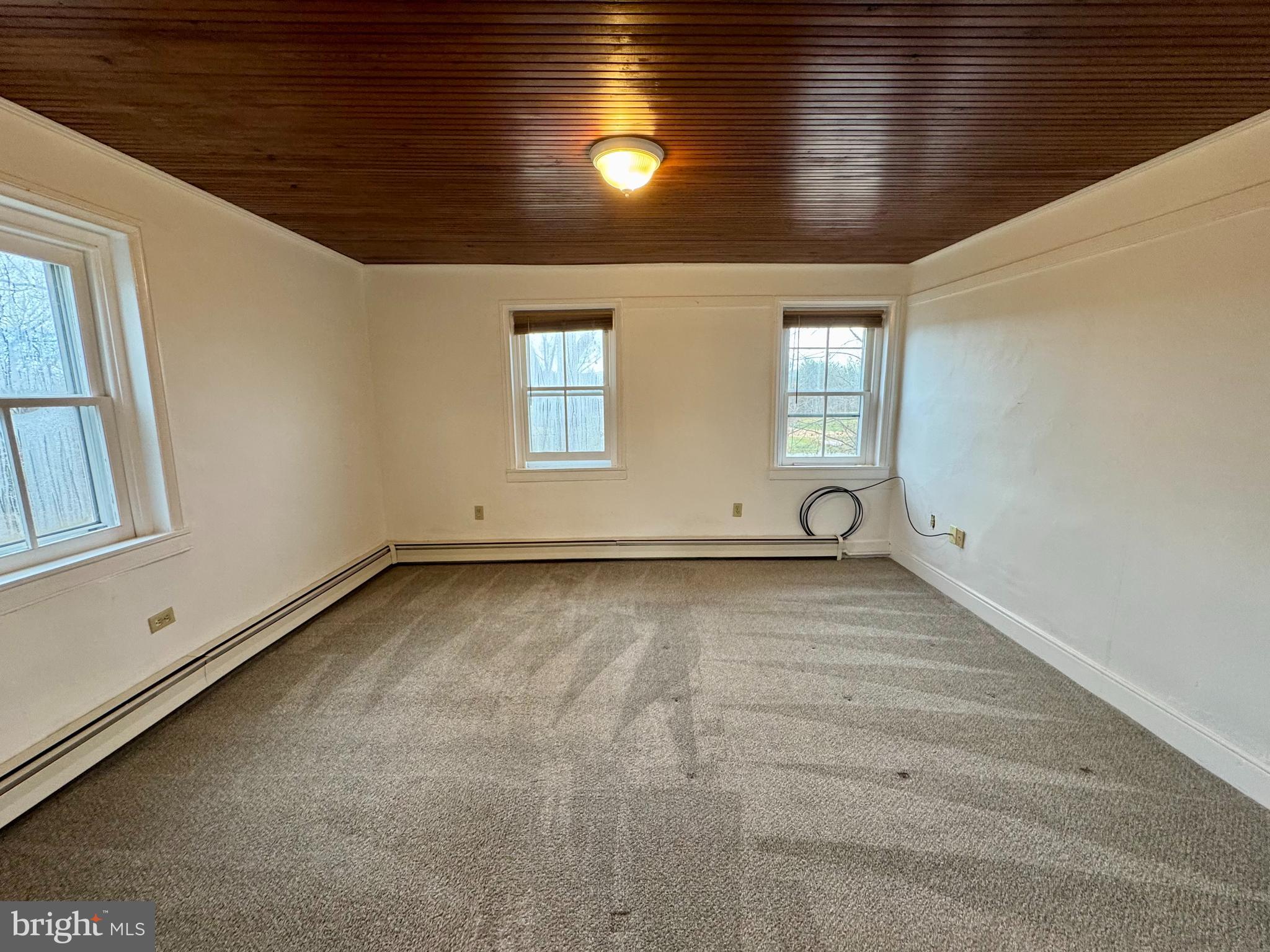 180 Sassamansville Road Gilbertsville, PA 19525 - Photo 14 of 20 a view of a livingroom with wooden floor and window