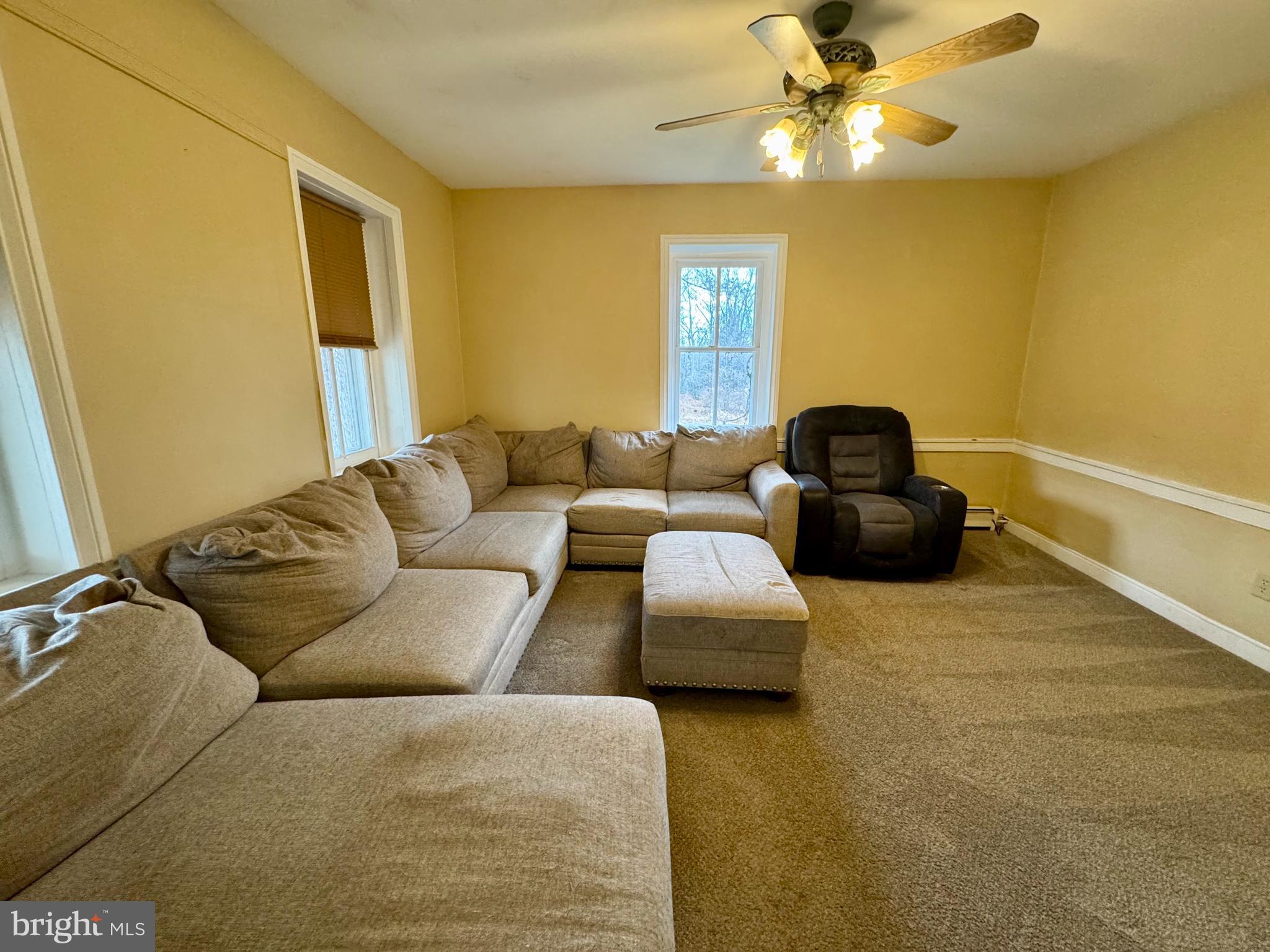 180 Sassamansville Road Gilbertsville, PA 19525 - Photo 5 of 20 a living room with furniture and a flat screen tv