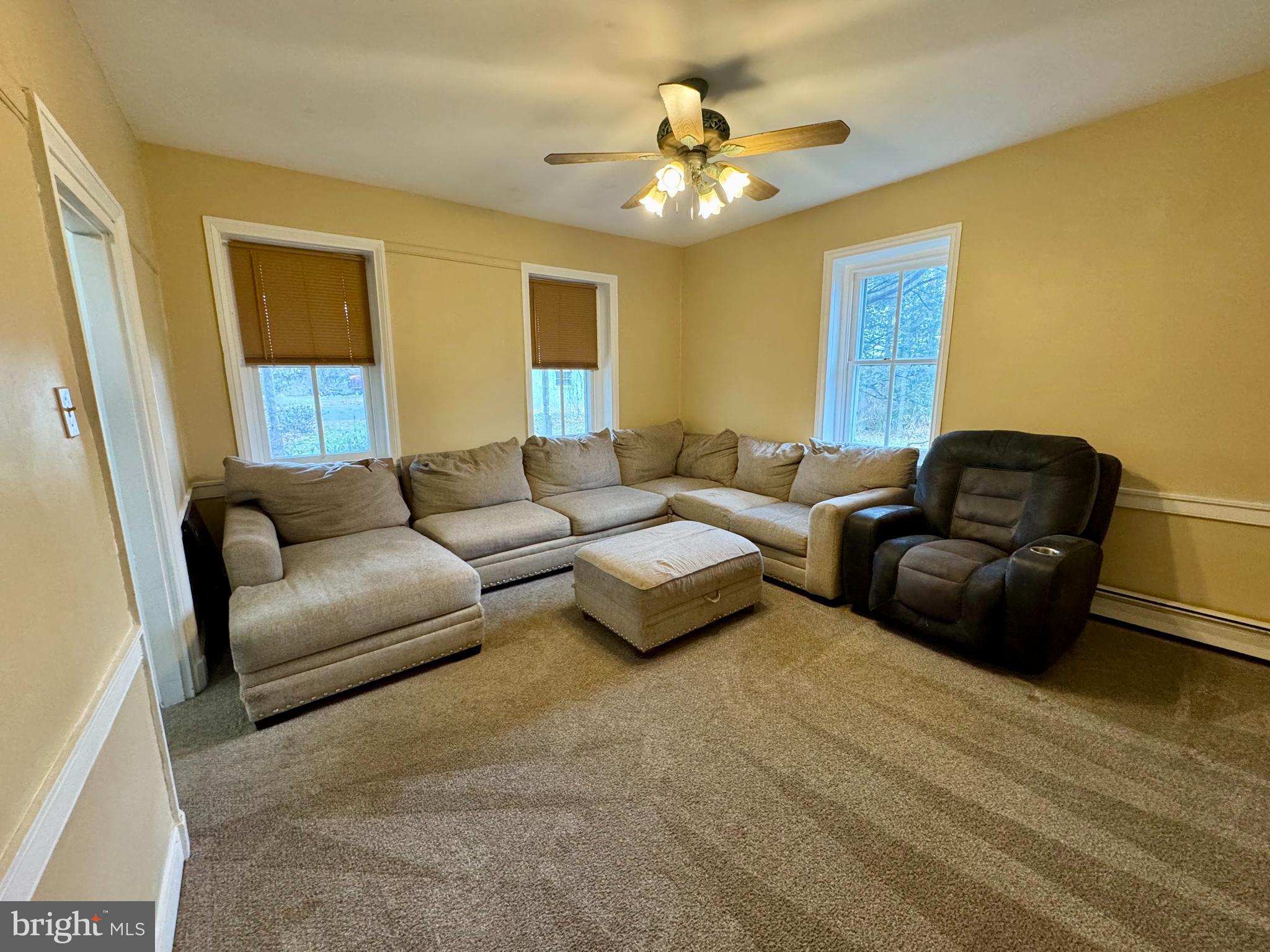 180 Sassamansville Road Gilbertsville, PA 19525 - Photo 6 of 20 a living room with furniture and a chandelier
