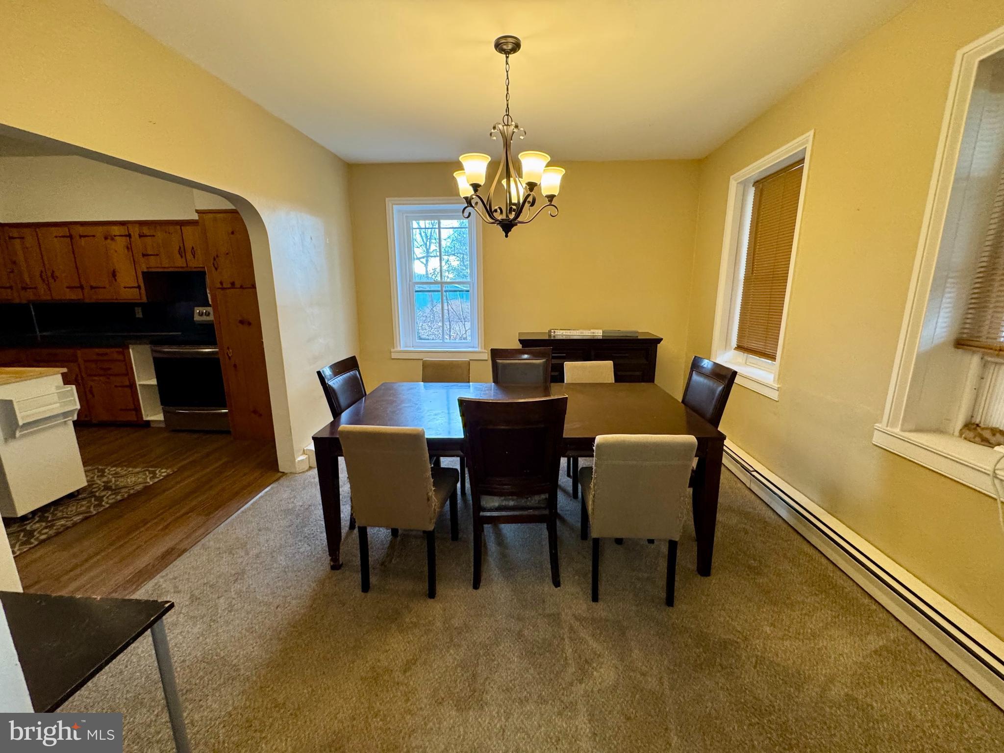 180 Sassamansville Road Gilbertsville, PA 19525 - Photo 7 of 20 a view of a dining room with furniture and a chandelier