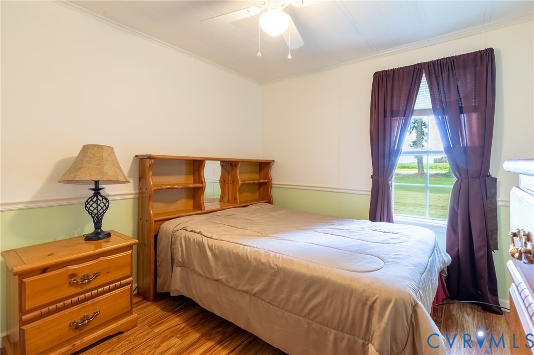 173 Antioch Road Warfield, VA 23889 - Photo 12 of 26 a bedroom with a bed and a mirror