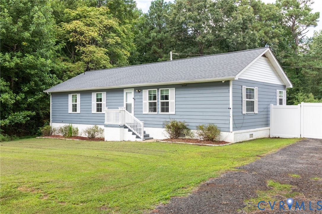 173 Antioch Road Warfield, VA 23889 - Photo 19 of 26 a front view of house with yard and green space