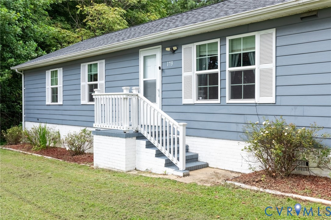 173 Antioch Road Warfield, VA 23889 - Photo 26 of 26 a view of a house with a yard and a garden