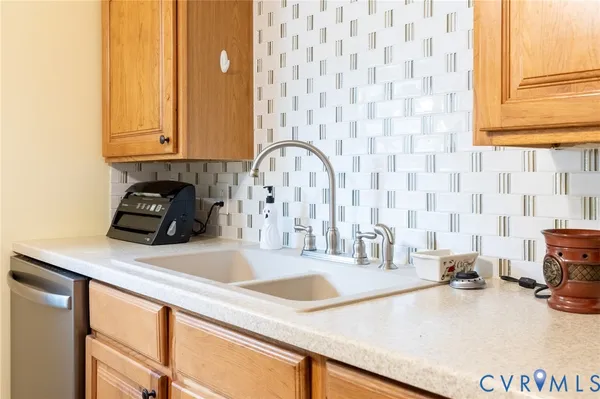a kitchen with a sink and cabinets