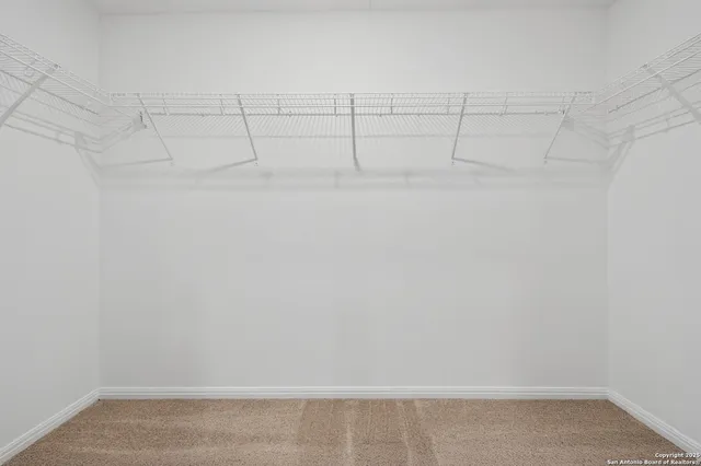 a view of a room with racks on the wall
