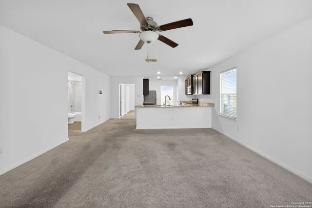 a view of a kitchen with a sink and a dishwasher