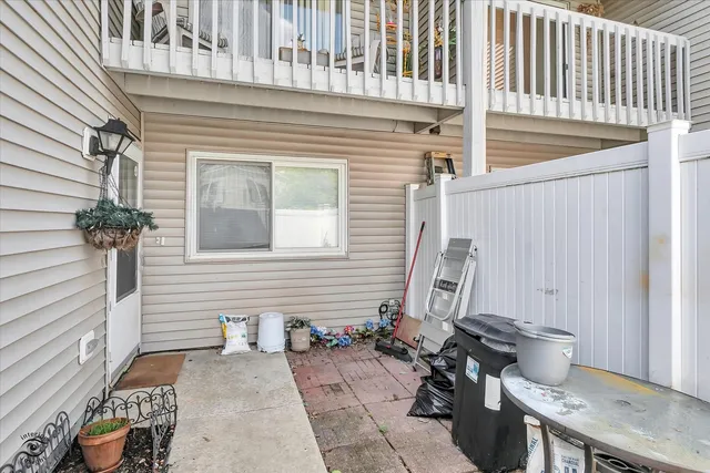 a backyard of a house with outdoor seating