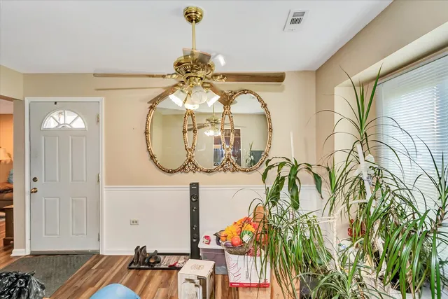 a bathroom with a sink a toilet and shower curtain