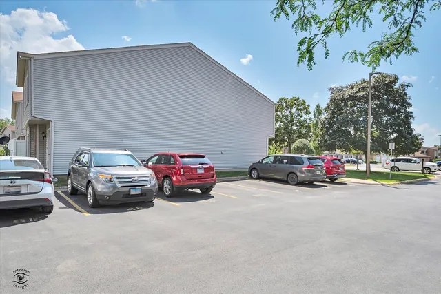 a view of a cars parked in front of a house