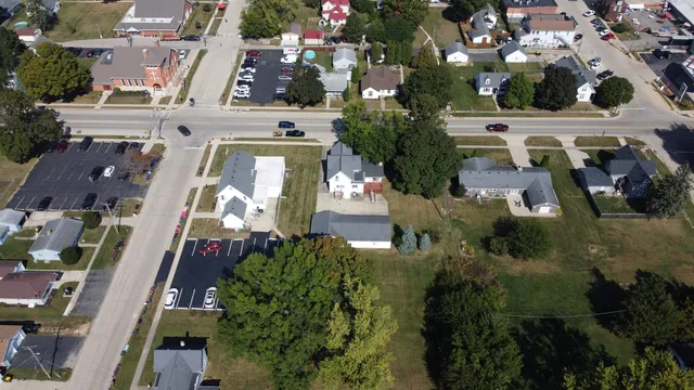 an aerial view of a residential apartment building with a yard