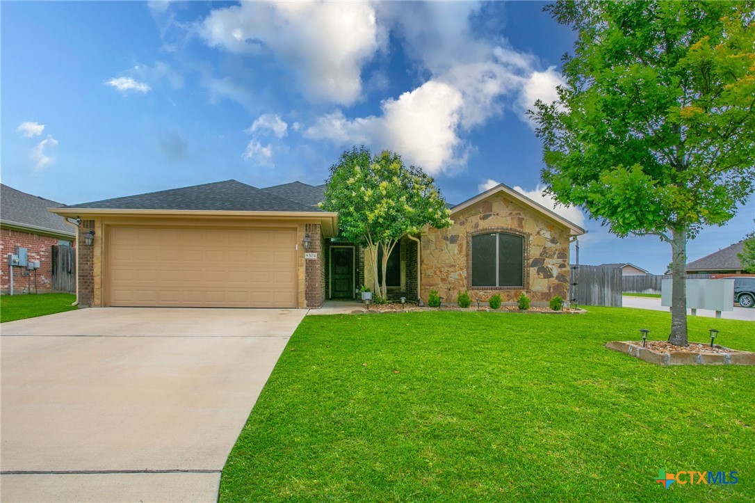 8304 Split Trl Cove Temple, TX 76502 - Photo 1 of 28 a front view of a house with garden