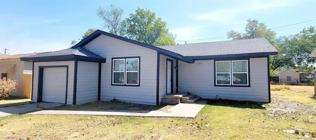 a view of house with yard