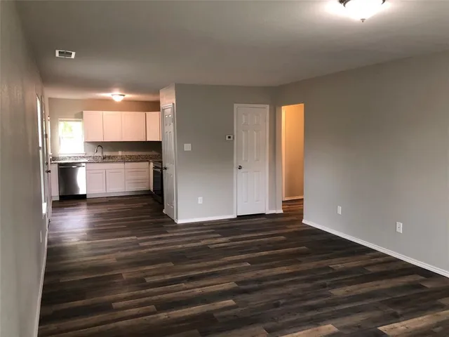 a view of kitchen and refrigerator