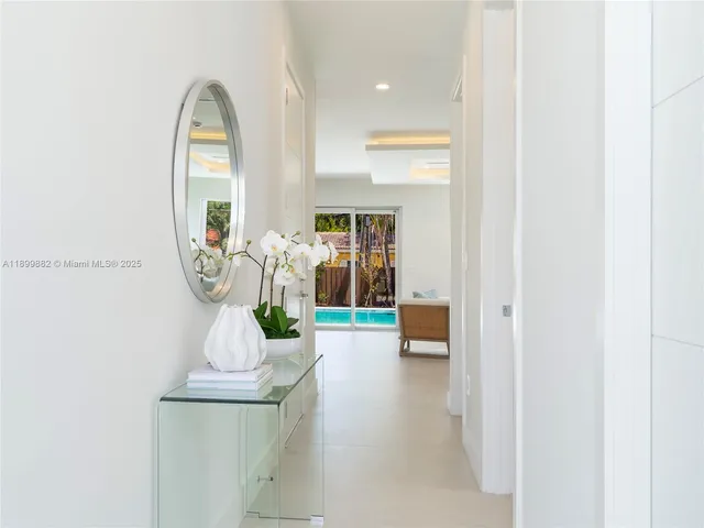 a view of living room with furniture and wooden floor